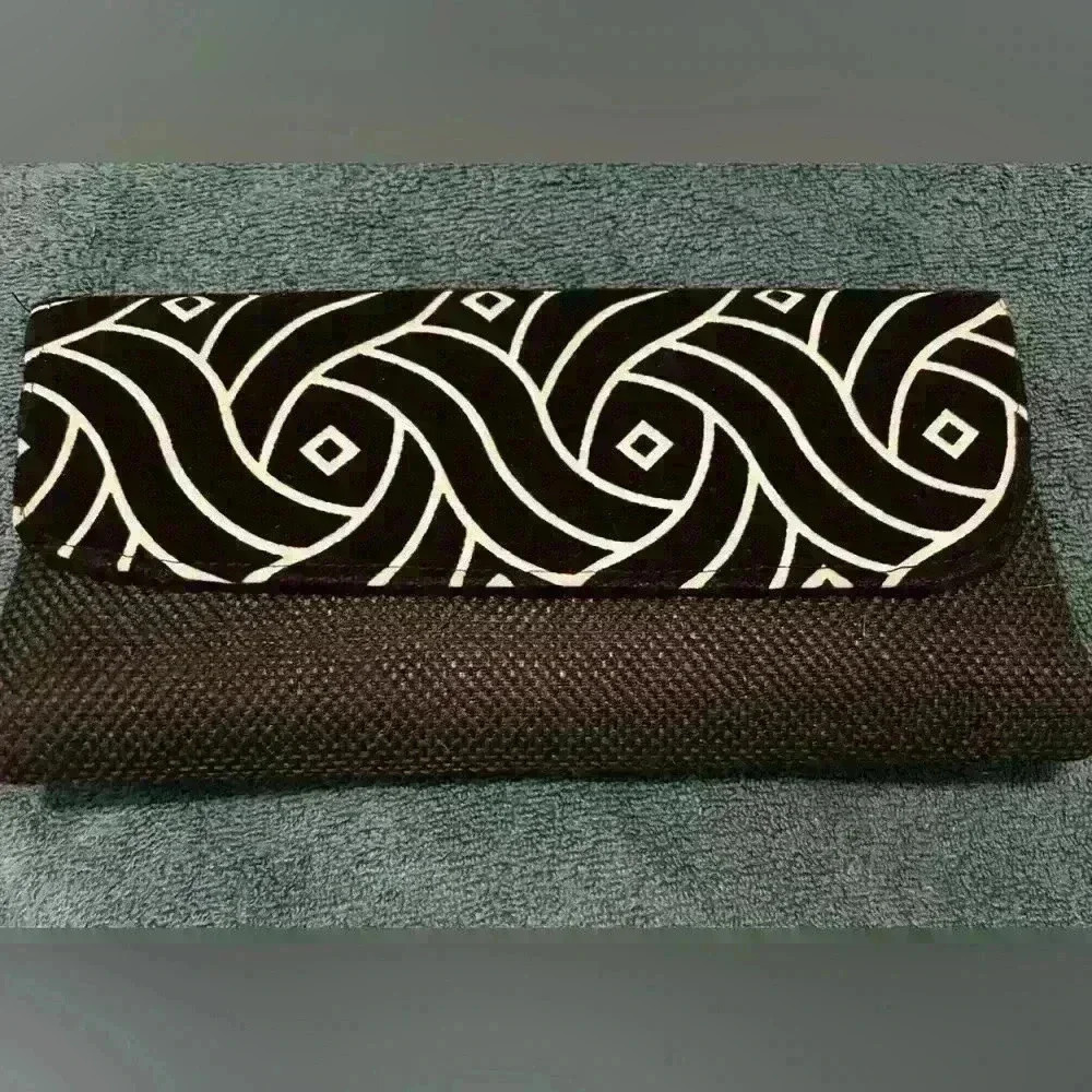Black hand woven clutch with fancy print  clean new condition